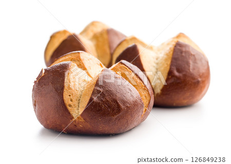 Crunchy bavarian buns isolated on white background. Crunchy bavarian buns isolated on white background. 126849238