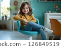 Smiling Girl in Cozy Room 126849519