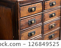 Antique Wooden Cabinet with Many Drawers 126849525