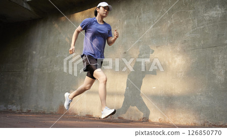 Outdoor Running Routine on a Sunny Day. Running Motivation. Start Your Fitness Journey. 126850770