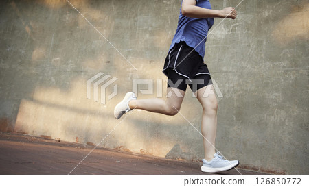 Outdoor Running Routine on a Sunny Day. Running Motivation. Start Your Fitness Journey. Outdoor Running Routine on a Sunny Day. Running Motivation. Start Your Fitness Journey. 126850772