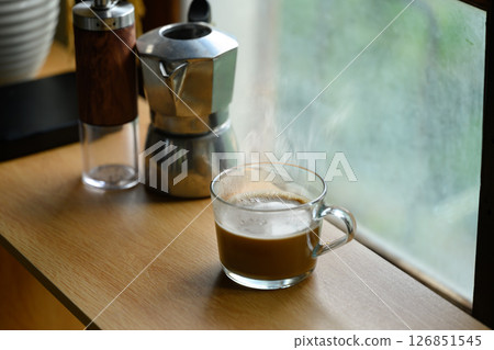 Morning coffee by the window with natural light Morning coffee by the window with natural light 126851545