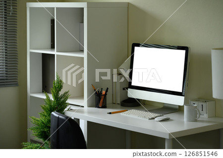 Computer monitor, and office supplies in a bright and stylish home office Computer monitor, and office supplies in a bright and stylish home office 126851546