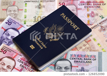 American passport on a Swazi lilangeni American passport on a Swazi lilangeni 126852090