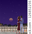 Young couple standing on the balcony in the evening against the backdrop of the night city. Vector. 126852256