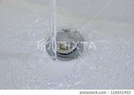 Clear Water Swirls Into The Bathroom Drain 126852402