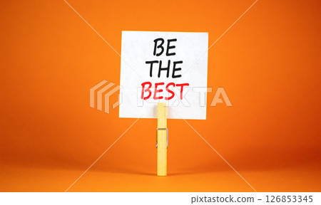 Motivational be the best symbol. Concept words Be the best on beautiful white paper on clothespin. Beautiful orange background. Business motivational be the best concept. Copy space. Motivational be the best symbol. Concept words Be the best on beautiful white paper on clothespin. Beautiful orange background. Business motivational be the best concept. Copy space. 126853345