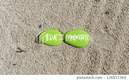 FDA Food and Drug Administration payment symbol. Concept words FDA payment on beautiful green stone. Beautiful sand beach background. Business FDA payment concept. Copy space. FDA Food and Drug Administration payment symbol. Concept words FDA payment on beautiful green stone. Beautiful sand beach background. Business FDA payment concept. Copy space. 126853369