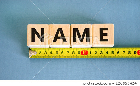 Name symbol. Concept word Name on beautiful wooden blocks. Beautiful yellow ruler. Beautiful blue table blue background. Business, lifestyle, support and name concept. Copy space. 126853424