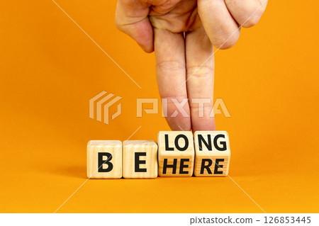 Belonging and belong symbol. Concept words Be here Belong on beautiful wooden block. Beautiful orange background Businessman hand. Business motivational belonging and belong concept. Copy space. Belonging and belong symbol. Concept words Be here Belong on beautiful wooden block. Beautiful orange background Businessman hand. Business motivational belonging and belong concept. Copy space. 126853445