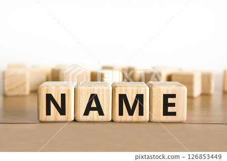 Name symbol. Concept word Name on beautiful wooden blocks. Beautiful wooden table white background. Business, lifestyle, support and name concept. Copy space. Name symbol. Concept word Name on beautiful wooden blocks. Beautiful wooden table white background. Business, lifestyle, support and name concept. Copy space. 126853449