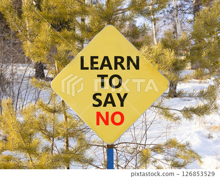 Learn to say no symbol. Concept words phrase Learn to say no on beautiful yellow road sign. Beautiful winter forest background. Business psychological Learn to say no concept. Copy space. 126853529