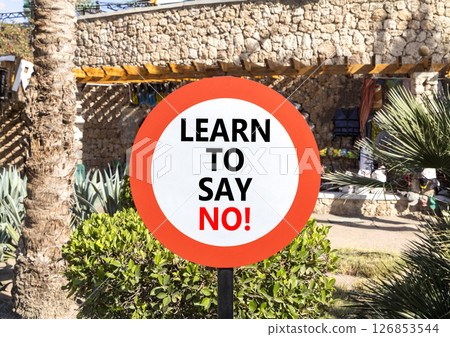 Learn to say no symbol. Concept words phrase Learn to say no on beautiful road sign. Beautiful palm tree background. Business psychological Learn to say no concept. Copy space. Learn to say no symbol. Concept words phrase Learn to say no on beautiful road sign. Beautiful palm tree background. Business psychological Learn to say no concept. Copy space. 126853544