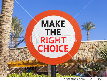 Make the right choice symbol. Concept words phrase Make the right choice on beautiful road sign. Beautiful palm tree and blue sky background. Business Make the right choice concept. Copy space. 126853545