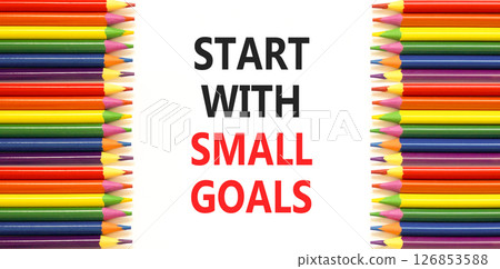 Start with small goals symbol. Concept words phrase Start with small goals on beautiful paper. Colored pencils. Beautiful white paper background. Business Start with small goals concept. Copy space. 126853588