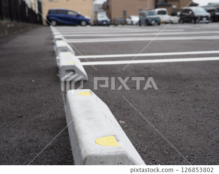 Scenery with road markings, a scene from a parking lot, space for small cars, copy space, curbs are also important 126853802