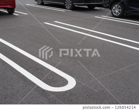 A scene in a parking lot. Copy space. Perfect for car-related materials. Can be used to advertise car spaces. A scene in a parking lot. Copy space. Perfect for car-related materials. Can be used to advertise car spaces. 126854214