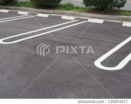 A scene in a parking lot. Copy space. Perfect for car-related materials. Can be used to advertise car spaces. 126854221