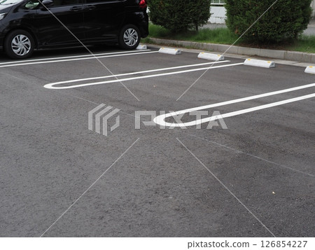 A scene in a parking lot. Copy space. Perfect for car-related materials. Can be used to advertise car spaces. A scene in a parking lot. Copy space. Perfect for car-related materials. Can be used to advertise car spaces. 126854227