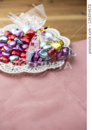 Colorful heart-shaped chocolates in a bag with copy space 126854678
