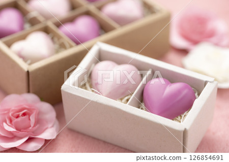 Close-up of heart-shaped chocolates arranged in a gift box 126854691