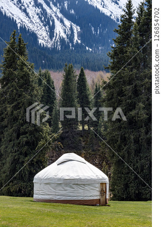 Dwelling of nomads in the mountains. Traditional house of kyrgyz people, white yurt 126854702