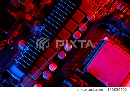 Red and Blue Lit Motherboard Components Red and Blue Lit Motherboard Components 126854792