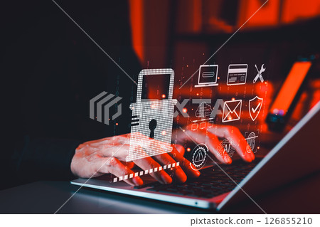 Cybersecurity and Data Protection Technology Concept. Hands typing on a laptop with a padlock icon and security symbols, representing data protection, cyber security, and secure online communication. Cybersecurity and Data Protection Technology Concept. Hands typing on a laptop with a padlock icon and security symbols, representing data protection, cyber security, and secure online communication. 126855210