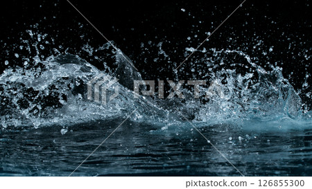 Clear water splash on a black background , close-up Clear water splash on a black background , close-up 126855300