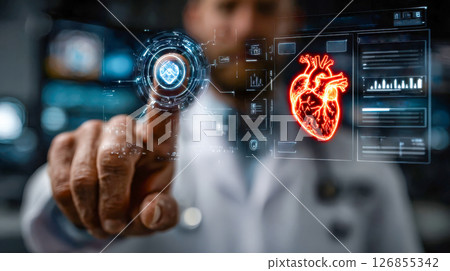 Doctor interacting with futuristic holographic medical interface displaying a glowing heart Doctor interacting with futuristic holographic medical interface displaying a glowing heart 126855342
