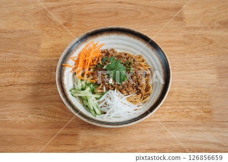 Noodles with minced meat and shredded vegetables. Delicious freshly prepared meal, perfect for menus, restaurants, or food delivery concepts. Noodles with minced meat and shredded vegetables. Delicious freshly prepared meal, perfect for menus, restaurants, or food delivery concepts. 126856659