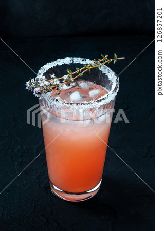 Salty Dog cocktail with fresh grapefruit juice, lime juice, and thyme 126857201