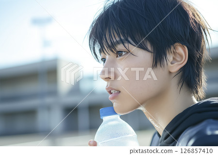 A man hydrating while exercising 126857410