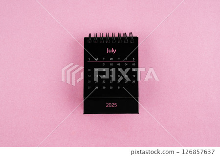 Black calendar for July 2025 year on pink background. Black calendar for July 2025 year on pink background. 126857637