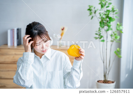 Woman holding a wallet, lack of money, saving 126857911