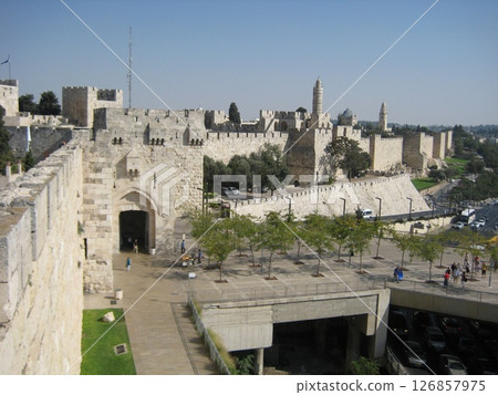 The massive white walls surrounding the Old City of Jerusalem The massive white walls surrounding the Old City of Jerusalem 126857975