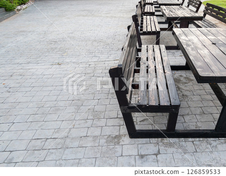 Aligned Wooden Benches on Brick Park Floor.. 126859533