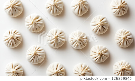 Top Down View of Raw Dumplings Evenly Arranged on White Background 126859845