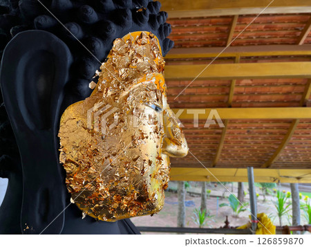 statue of buddha, Buddha statue adorned with gold leaf, symbolizing devotion and spiritual reverence in Thai Buddhism, temple sculpture statue of buddha, Buddha statue adorned with gold leaf, symbolizing devotion and spiritual reverence in Thai Buddhism, temple sculpture 126859870
