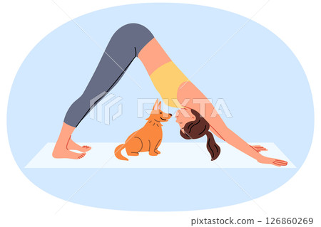 Woman does pilates on yoga mats and does stretching located near with funny puppy 126860269
