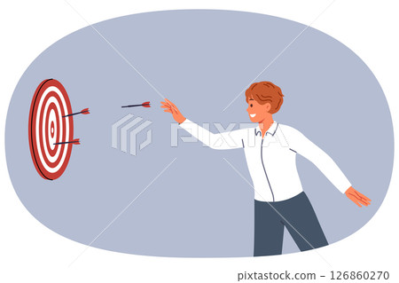 Business man is trying to hit target and achieve desired result by throwing darts at dartboard 126860270