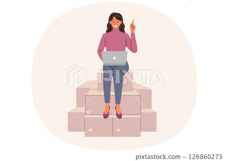 Woman entrepreneur works sitting on cardboard boxes with laptop on lap, sorting and logistics goods Woman entrepreneur works sitting on cardboard boxes with laptop on lap, sorting and logistics goods 126860273