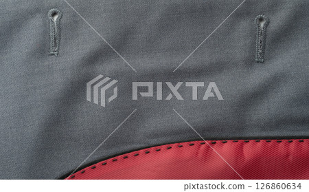 Fabric close-up showcasing intricate stitching and contrasting color details Fabric close-up showcasing intricate stitching and contrasting color details 126860634