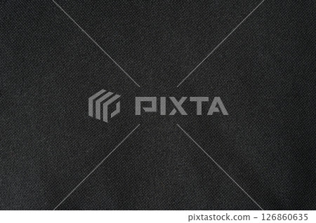 Textured black fabric with fine weave and subtle details in soft light Textured black fabric with fine weave and subtle details in soft light 126860635