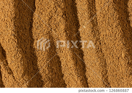 Fine Brown Ground Cinnamon. Culinary Background. 126860887