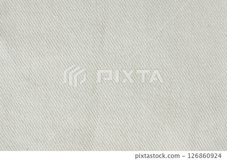 Macro texture of a fabric consisting of one hundred percent cotton. Macro texture of a fabric consisting of one hundred percent cotton. 126860924