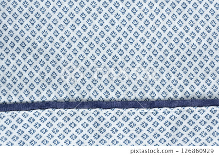 Macro texture of a fabric consisting of one hundred percent cotton. 126860929