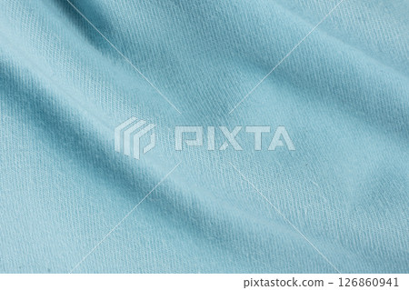 Macro texture of blue fabric consisting of cotton with a slight addition of spandex. Macro texture of blue fabric consisting of cotton with a slight addition of spandex. 126860941