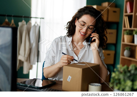 designer is working in studio 126861267