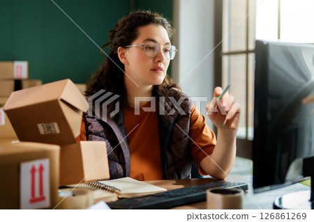 Woman working in a warehouse Woman working in a warehouse 126861269
